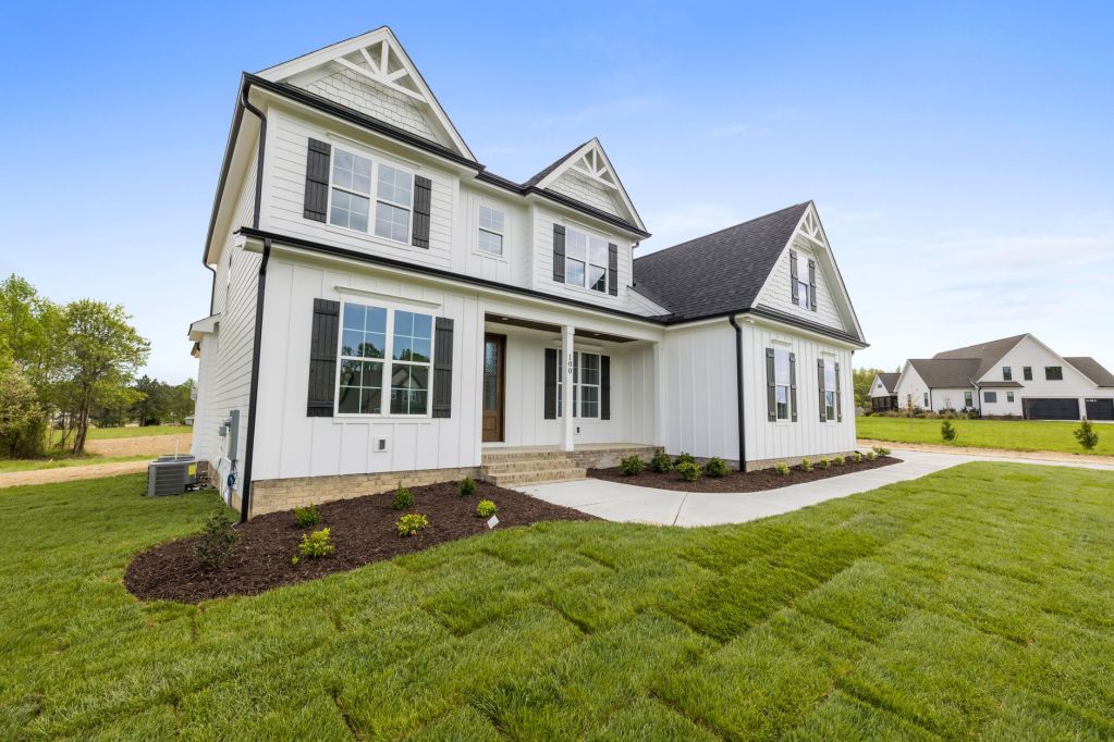 house with green grass on the lawn